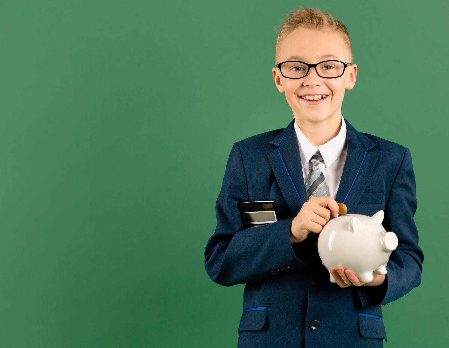 young-boy-holding-piggy-bank